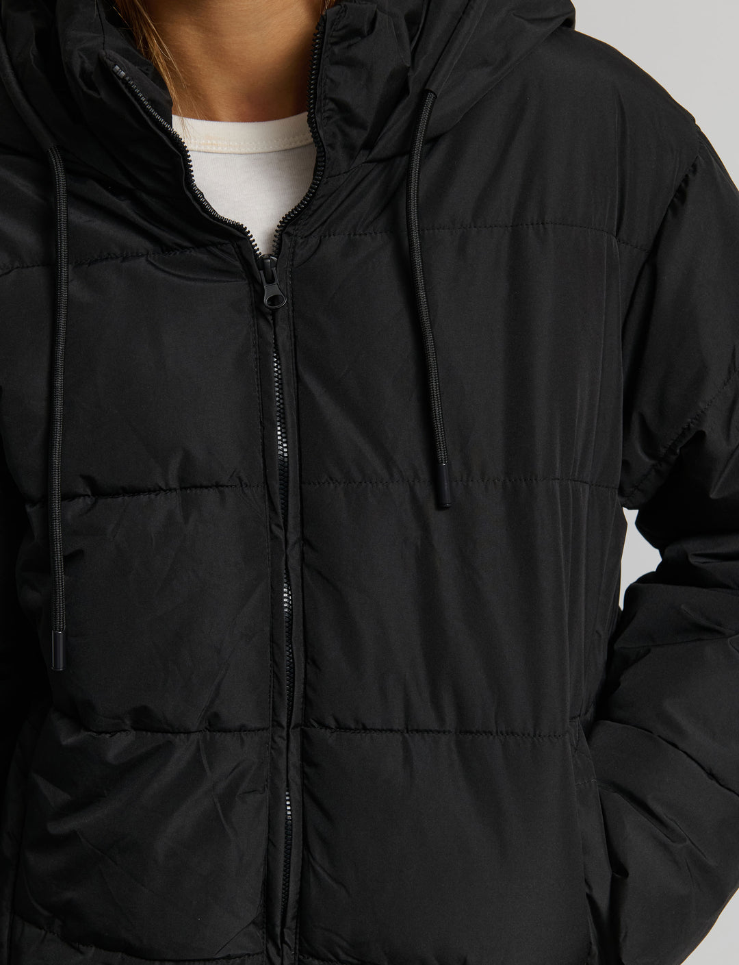 Piumino con cappuccio