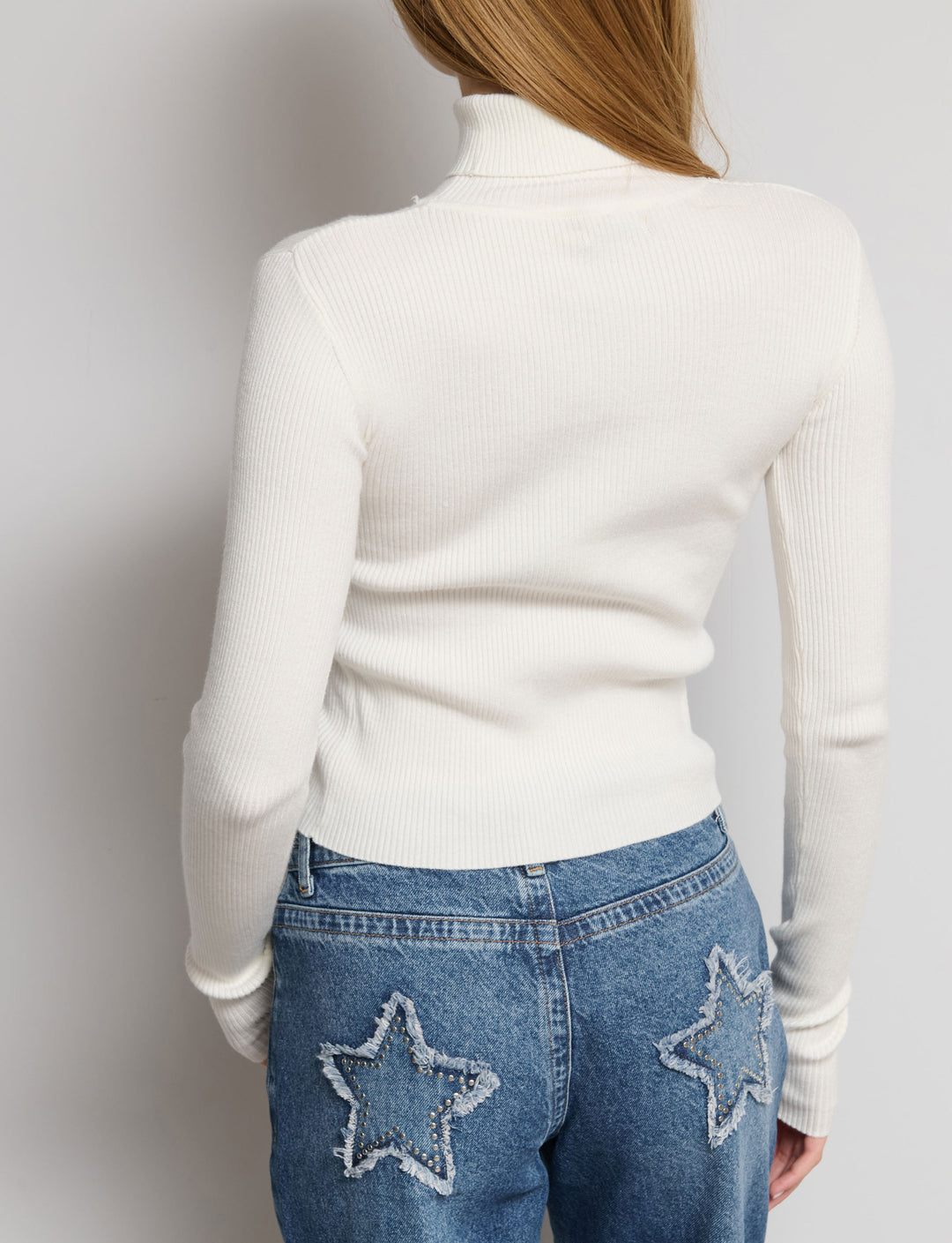 Maglia a costine collo alto