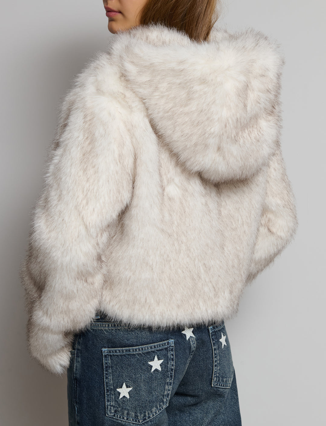 Giacca effetto pelliccia con cappuccio