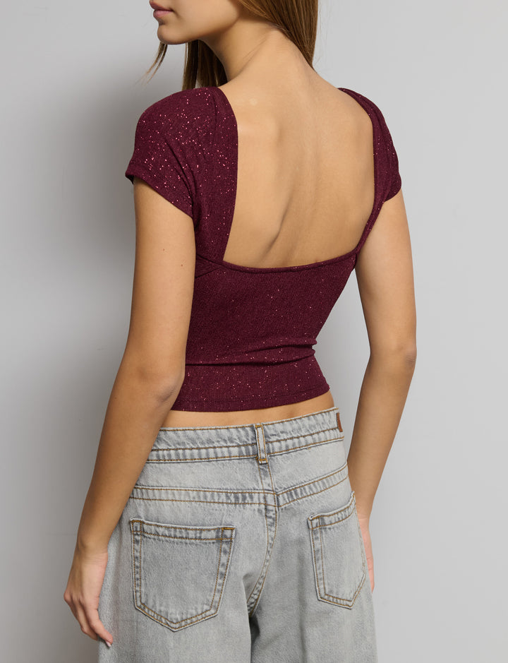 Top manica corta in tessuto glitter
