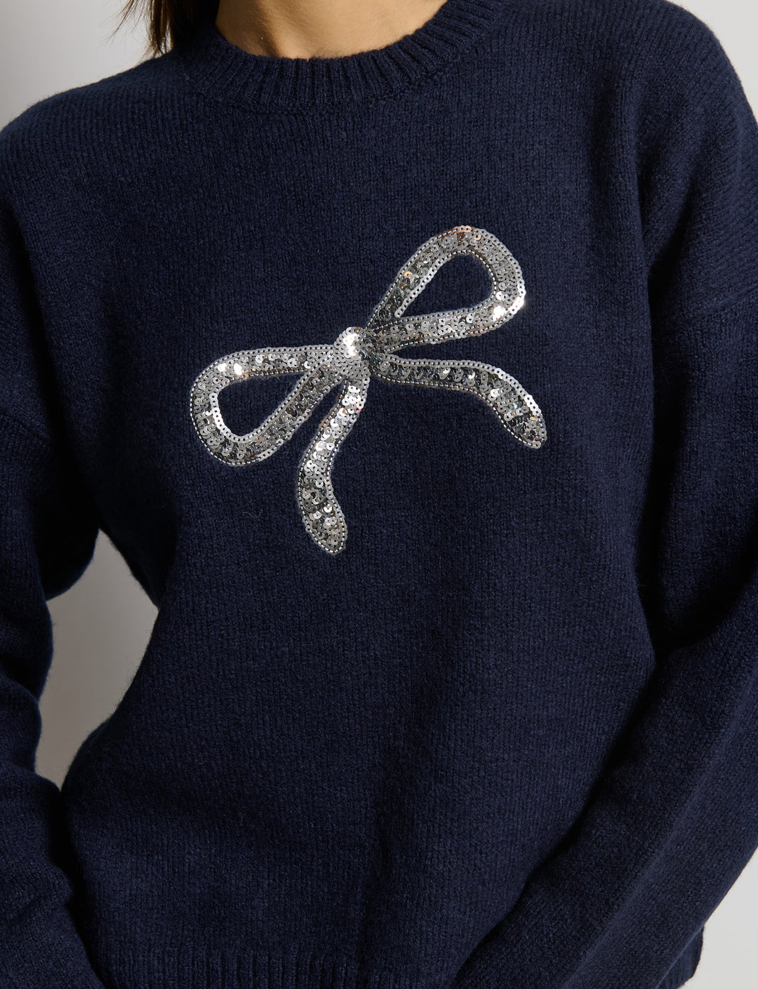 Mglione con fiocco in paillettes