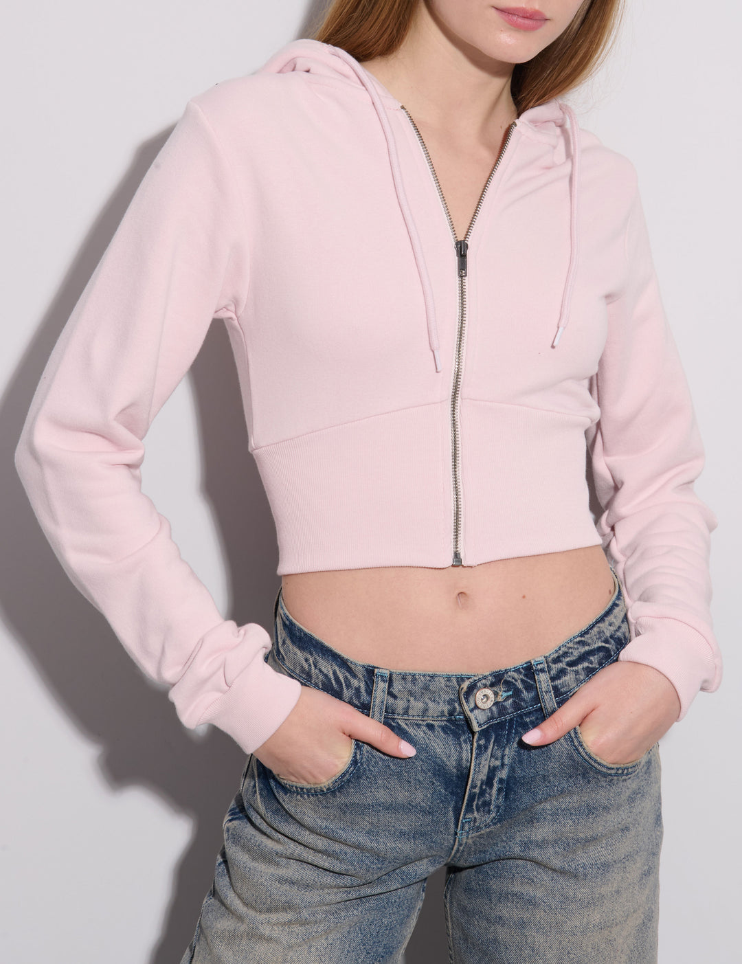 Felpa crop rosa effetto corsetto frontale