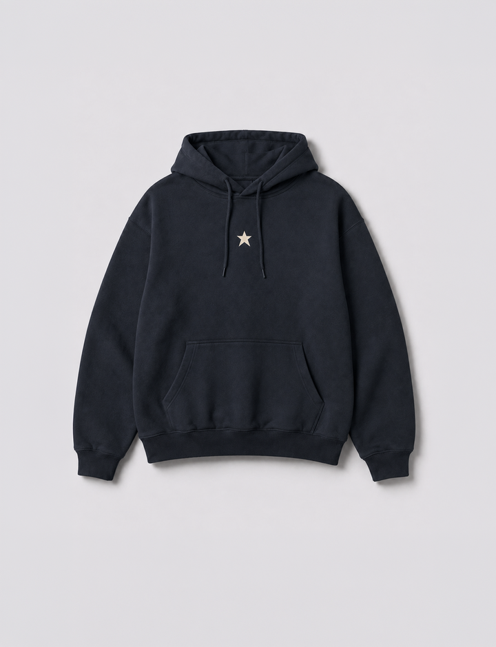 Felpa oversize blu notte con stelle e scritta "Born Iconic" still life frontale