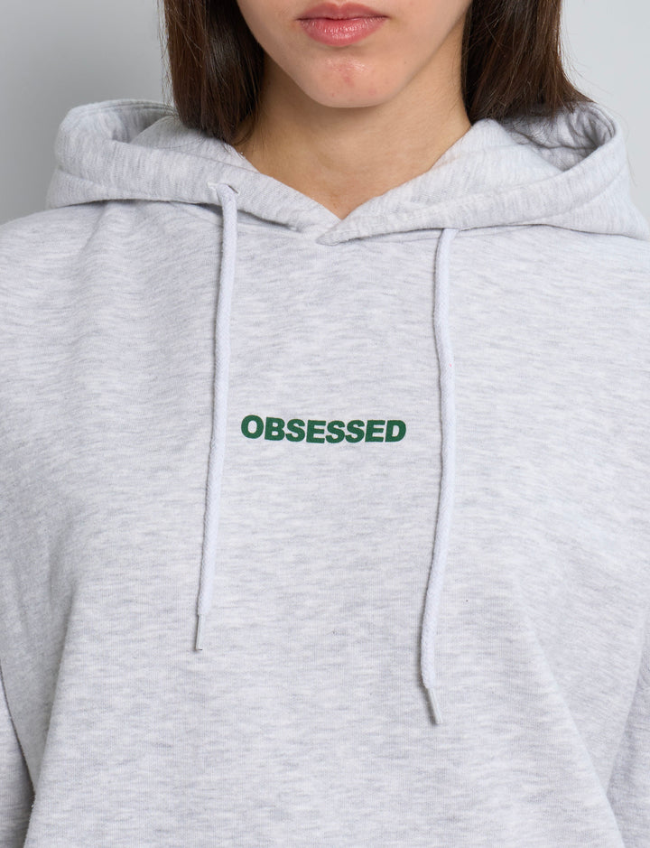 Felpa oversize grigia con scritta OBSESSED dettaglio