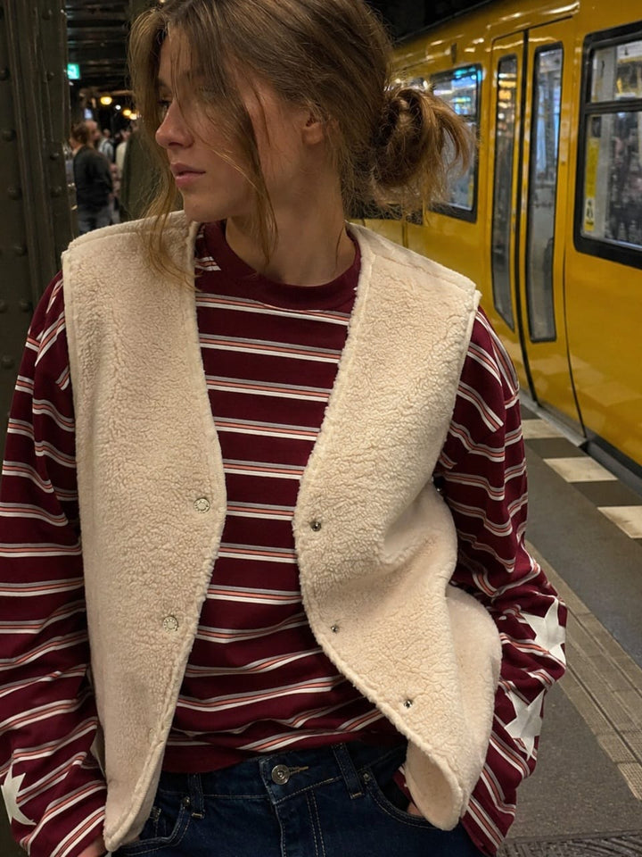 Gilet smanicato teddy panna copertina