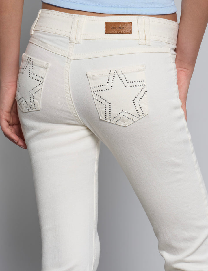 Jeans panna svasati con stelle in borchie dettaglio
