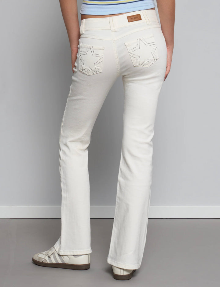 Jeans panna svasati con stelle in borchie retro