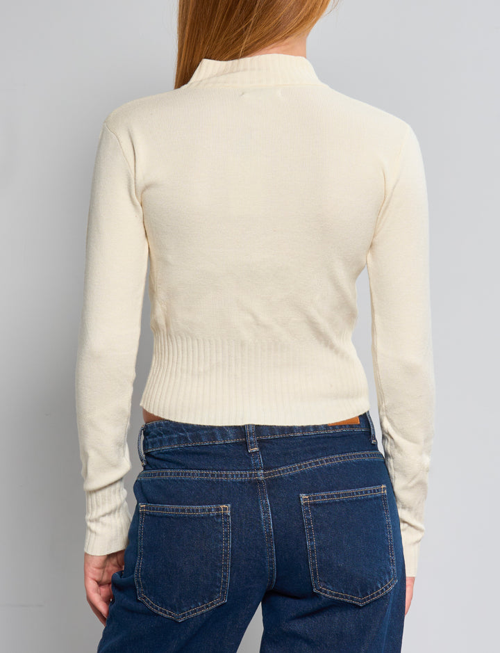 Maglione corto panna con zip e collo alto retro