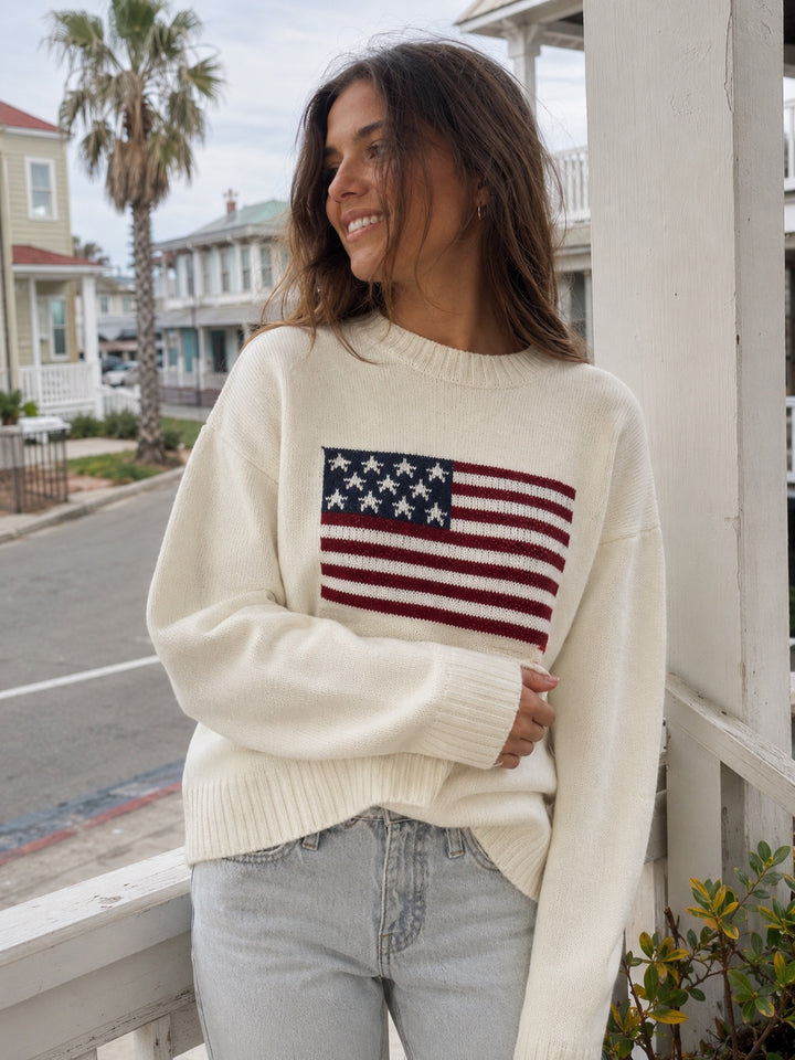 Maglione panna con bandiera americana copertina