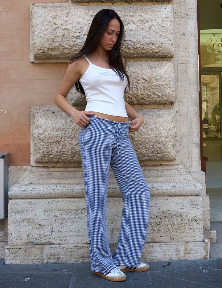 Pantalone a quadretti blu copertina