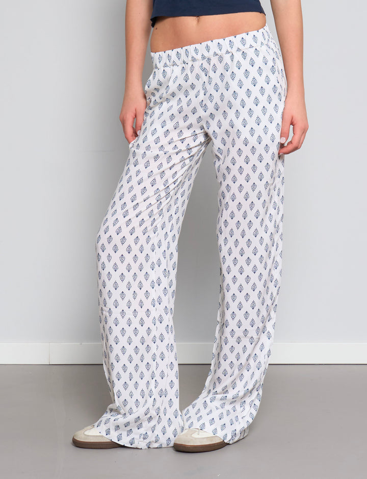 Pantalone leggero panna con stampe blu frontale
