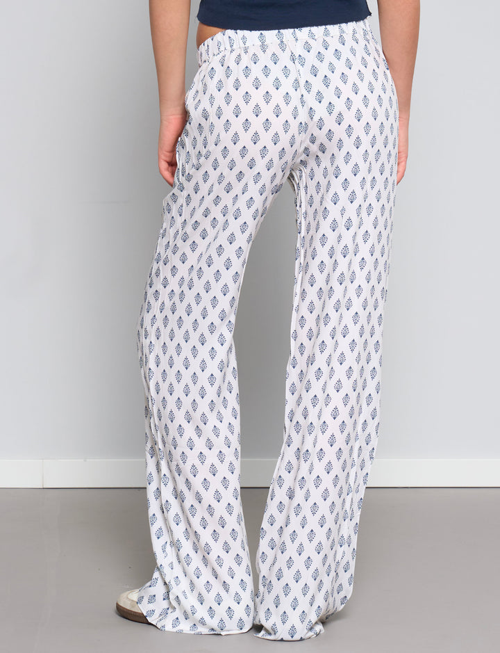 Pantalone leggero panna con stampe blu retro