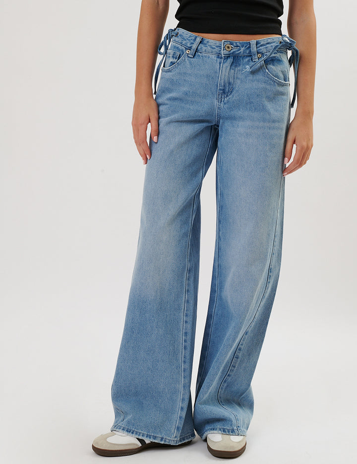 Jeans wide con fiocchetti