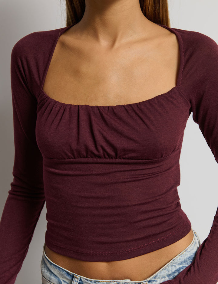 Top manica lunga con scollo arricciato