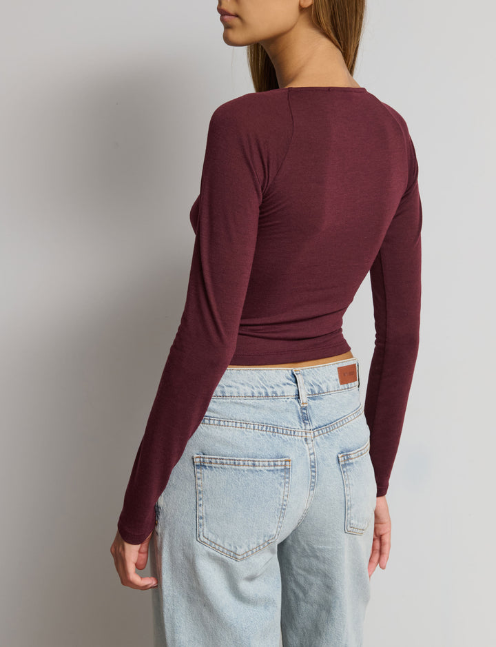 Top manica lunga con scollo arricciato