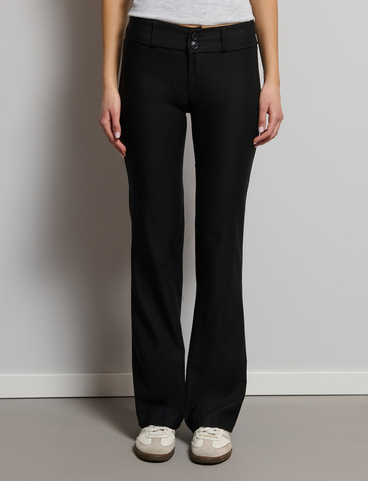 Pantalone boo-tcut con doppio bottone laterale