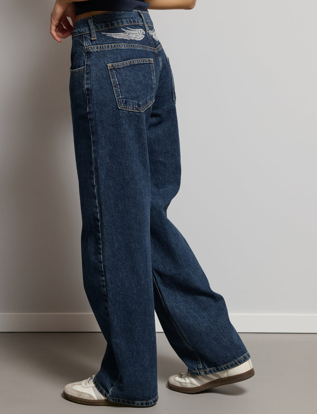 Jeans con ali paillettes