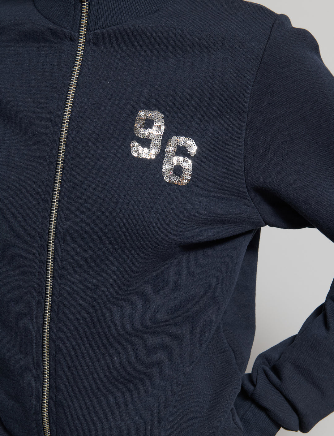 Felpa collo alto con paillettes