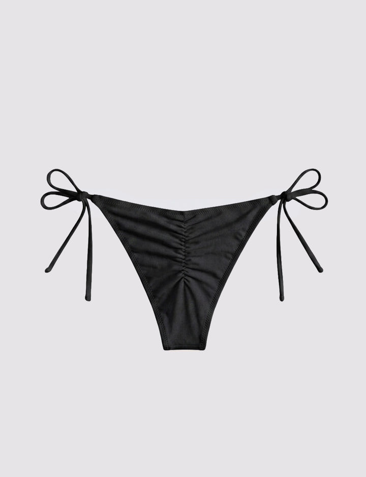 Slip bikini nero con arricciatura retro