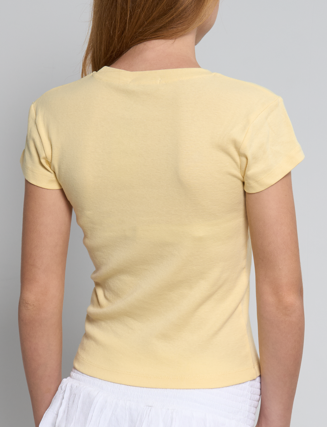 T-shirt gialla con stampa sole retro
