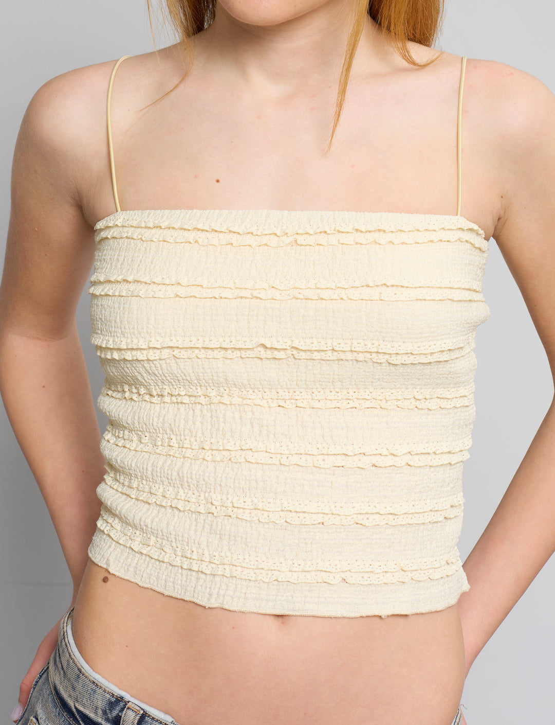 Top a fascia giallo pastello con rouches dettaglio