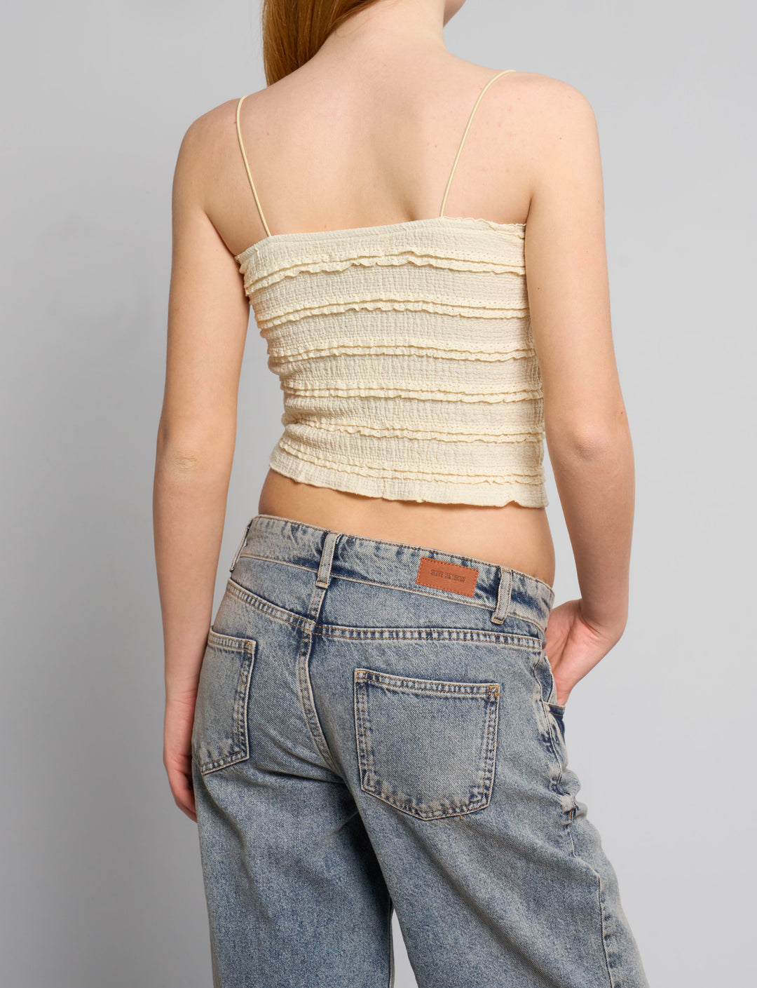 Top a fascia giallo pastello con rouches retro