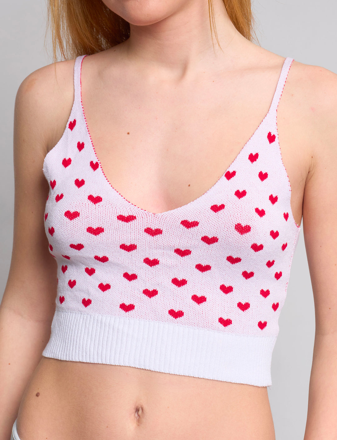 Top in maglia con cuoricini