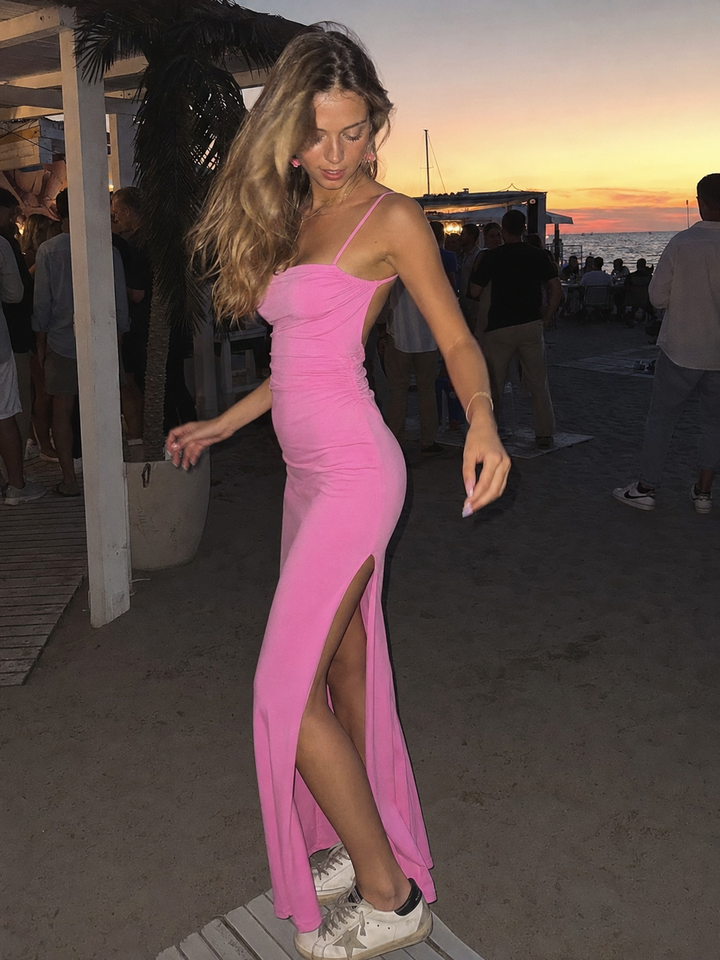Vestito lungo fucsia con schiena scoperta