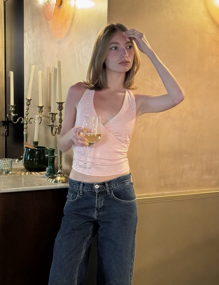 Top incrociato in tessuto glitter