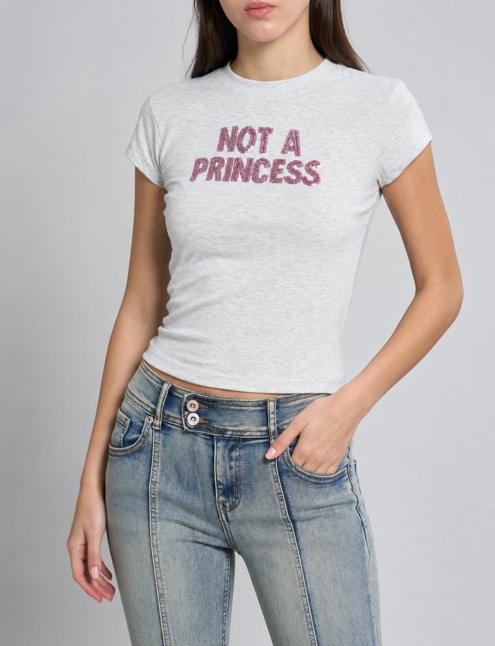 T-shirt grigia con scritta in paillettes